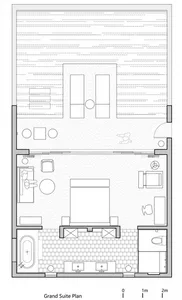 Grand suite layout plan depicting a bedroom and attached bathroom with furniture and fixtures indicated.