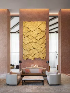 A modern lobby with a contemporary concrete art wall and minimalist seating area