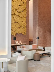 Modern hotel lobby with concrete texture walls and contemporary furniture.