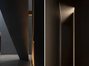 A modern interior space with dark wooden elements and concrete walls.