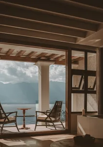 A modern residential interior featuring wood and concrete elements.