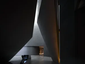 Modern lobby with metallic and concrete architectural features