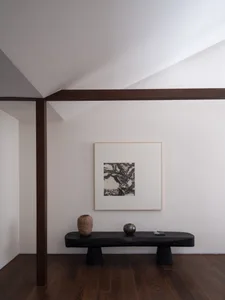 Modern living room with teak furniture and decorative wall art
