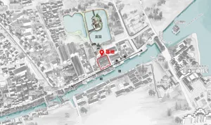 A detailed map of an ancient town with labeled buildings and pathways.