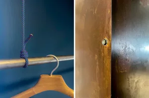 A close-up image of a metal attachment bolt and nut on a wooden surface.