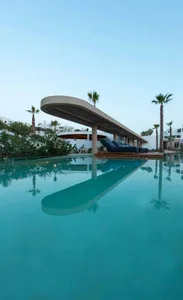 Swimming pool with minimalist design and concrete structure.