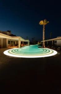Swimming pool with modern lighting design at night.