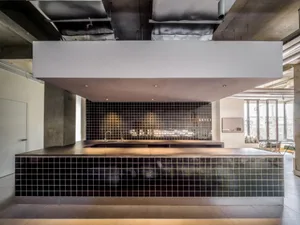 A modern kitchen featuring metallic finishes and sleek design.