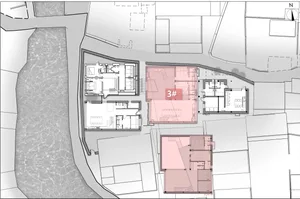 A residential architectural floor plan detailing apartment layouts and interior designs.