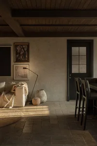 Industrial living room with concrete walls and minimalist decor.