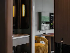 Modern bathroom featuring concrete walls and flooring.