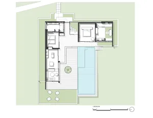 Floor plan of a modern residential house with white stone, glass, and steel elements.