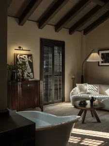 Modern living room with wooden walls and a cozy seating area.