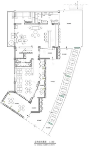 Floor plan of a modern office space featuring an open-plan layout with desks, chairs, and meeting areas.