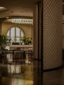 Modern restaurant interior featuring brick and clay tiles with mosaic patterns