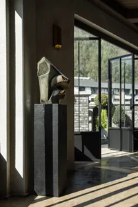 A modern sculpture made of marble in a contemporary setting.