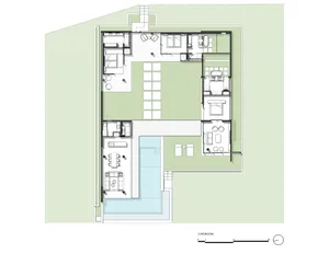 A residential floor plan featuring a layout with three bedrooms, a kitchen, and living areas.