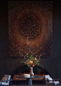 A contemporary lobby featuring metal elements and intricate wall art.