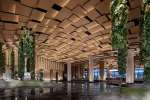 Modern hotel lobby featuring a contemporary design with wooden elements.