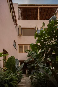 Clay-tiled roof exterior of a building with green foliage