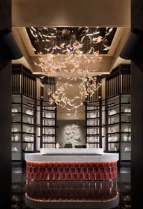 A luxury reception desk featuring elegant, artistic glass elements.