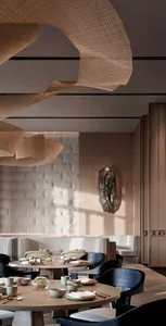 A minimalist restaurant interior featuring wooden tables, stone walls, and woven decorative elements.