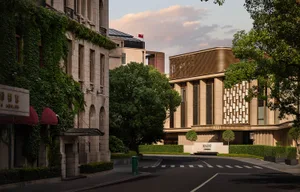 A modern architectural building with concrete and wood materials.