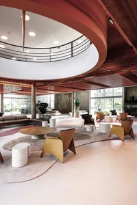 Modern commercial interior with concrete flooring and seating areas.