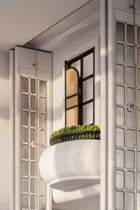 A modern residential interior featuring a glass window with greenery.