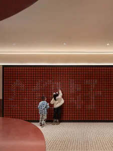 Children playing on a tile playground.