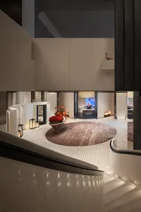 Modern lobby featuring marble floors and concrete accents