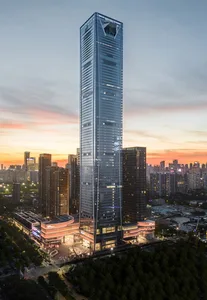 A modern office building with a glass exterior and steel structure.
