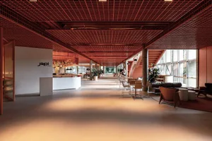 A spacious modern restaurant interior featuring a terrazzo floor and contemporary design elements.