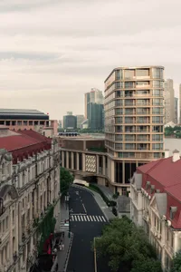 A modern cityscape featuring tall buildings constructed with glass, concrete, and steel.