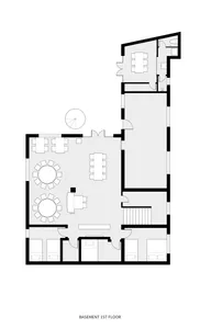 A detailed black and white office layout plan showing a spacious area with tables, chairs, and a staircase.