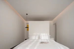 Modern bedroom with textured bedding and minimalist design
