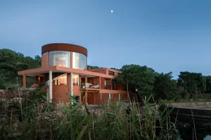 A modern residential building constructed from clay materials.