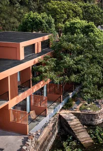 Modern residential building with concrete and glass exterior.