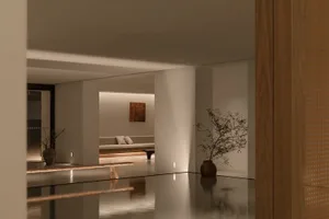Modern minimalist living room with concrete floor, wooden furniture, and minimalist decor.