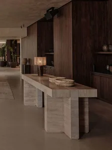 Modern interior space featuring wooden flooring and minimalist furniture.