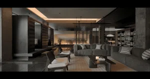 A modern living room with concrete walls and floors, featuring large sofas and a minimalist design.
