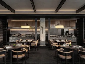 A stylish restaurant interior featuring modern marble and concrete elements.