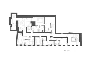 Floor plan of an industrial-style apartment with metal accents and concrete structural elements