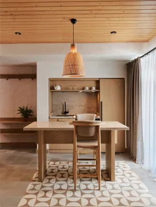 Modern minimalist kitchen with wooden furniture and a patterned floor