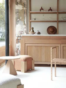 A minimalist residential space featuring wood elements and a white floor.