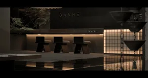 A minimalist spa interior with a sleek, modern design featuring a fountain and seating area.