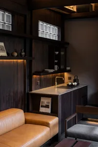 Industrial-style cafe interior with metallic finishes and functional bar area.