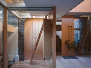 A minimalist living space with wooden beams