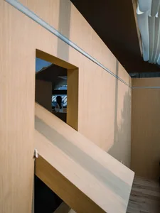 A minimalist interior design featuring wooden paneling.
