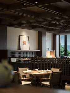 A modern restaurant interior with wooden tables, chairs, and a marble counter.